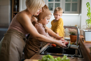 5 Reasons to Be Thankful for Your Septic System in Upstate SC - family washing dishes together